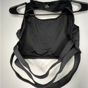 Boohoo black slightly open back sports bra